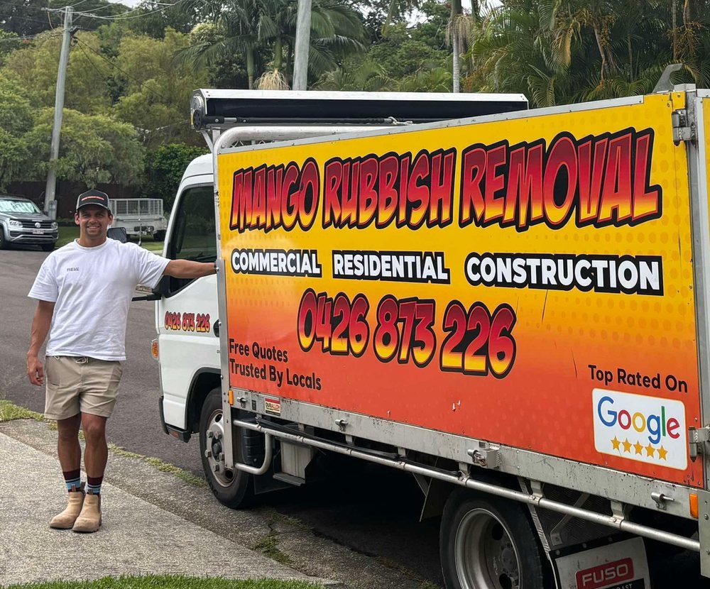 Natana Parata standing beside the Mango Rubbish Removal truck
