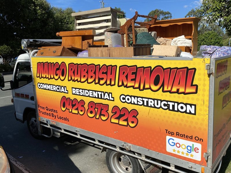 The Mango truck stacked high with furniture from a house clear-out