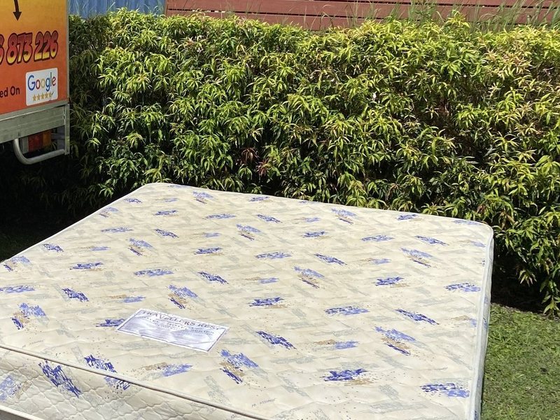 An old mattress collected kerbside next to the Mango truck
