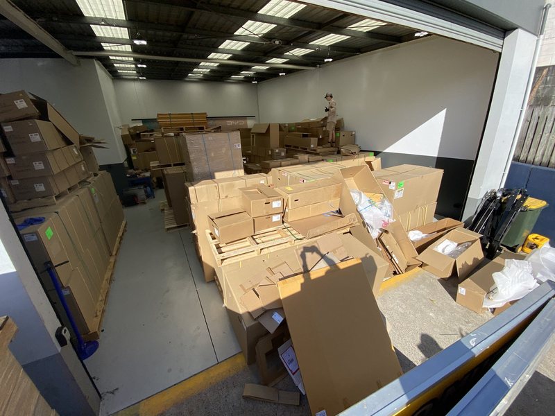 A warehouse full of packaging being cleared